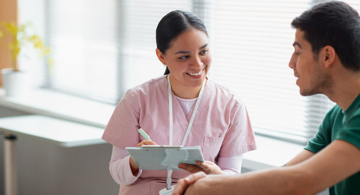 A care coordinator providing assistance and support to a patient