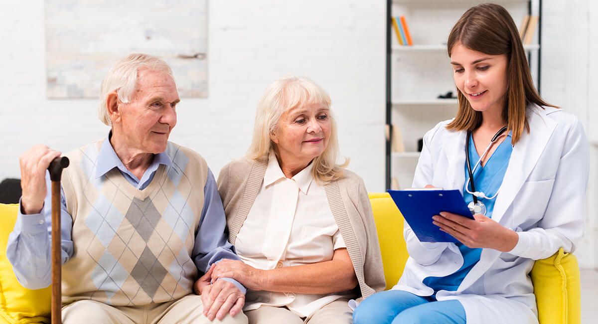 A caregiver assisting and providing attentive care for the seniors