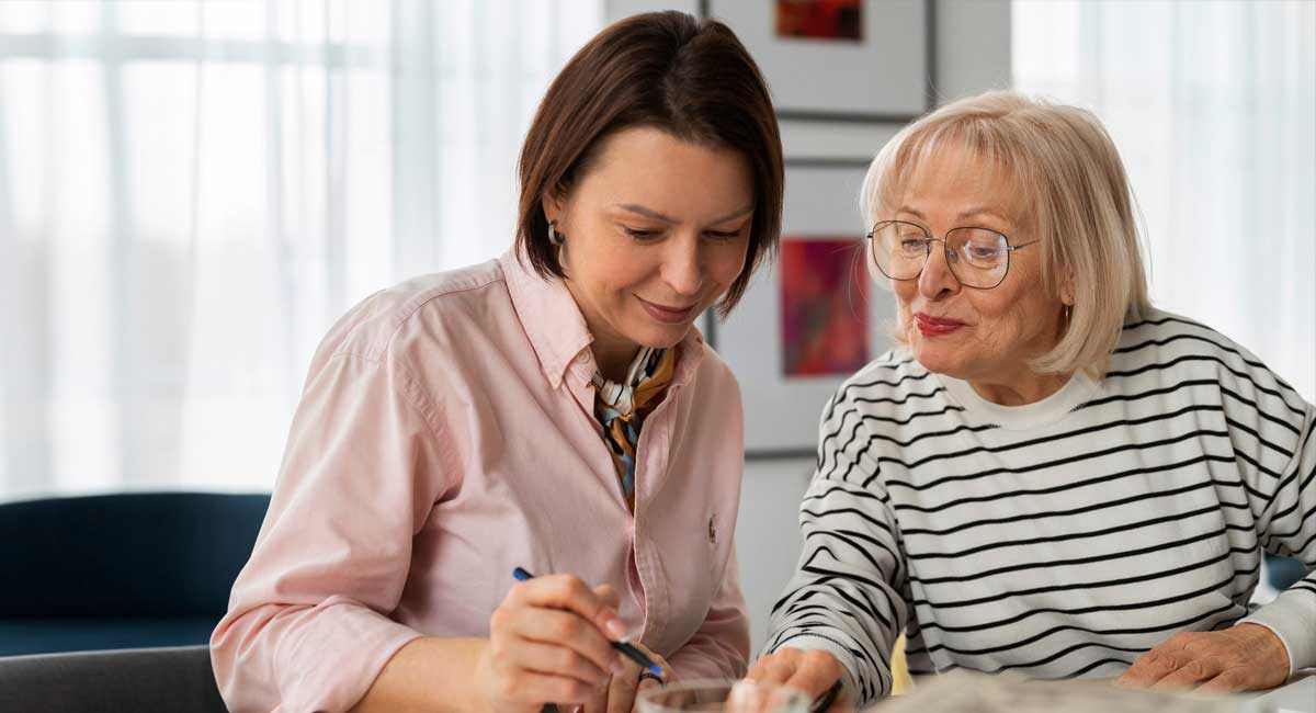 A respite care worker assisting a senior woman in reading a book