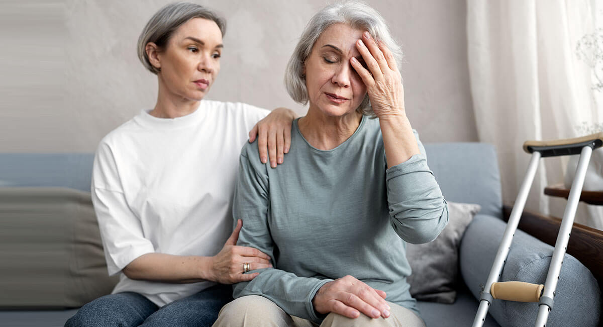 A carer comforting an Alzheimer's disease patient experiencing anxiety