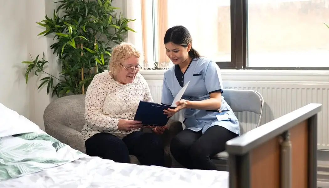 A caregiver working with a dementia patient performs a mental exercise