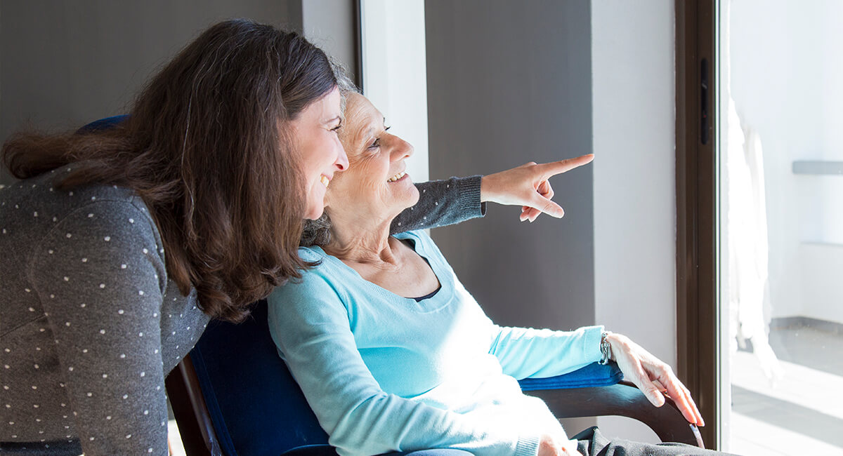 A carer attending an elderly person in a care home in the UK