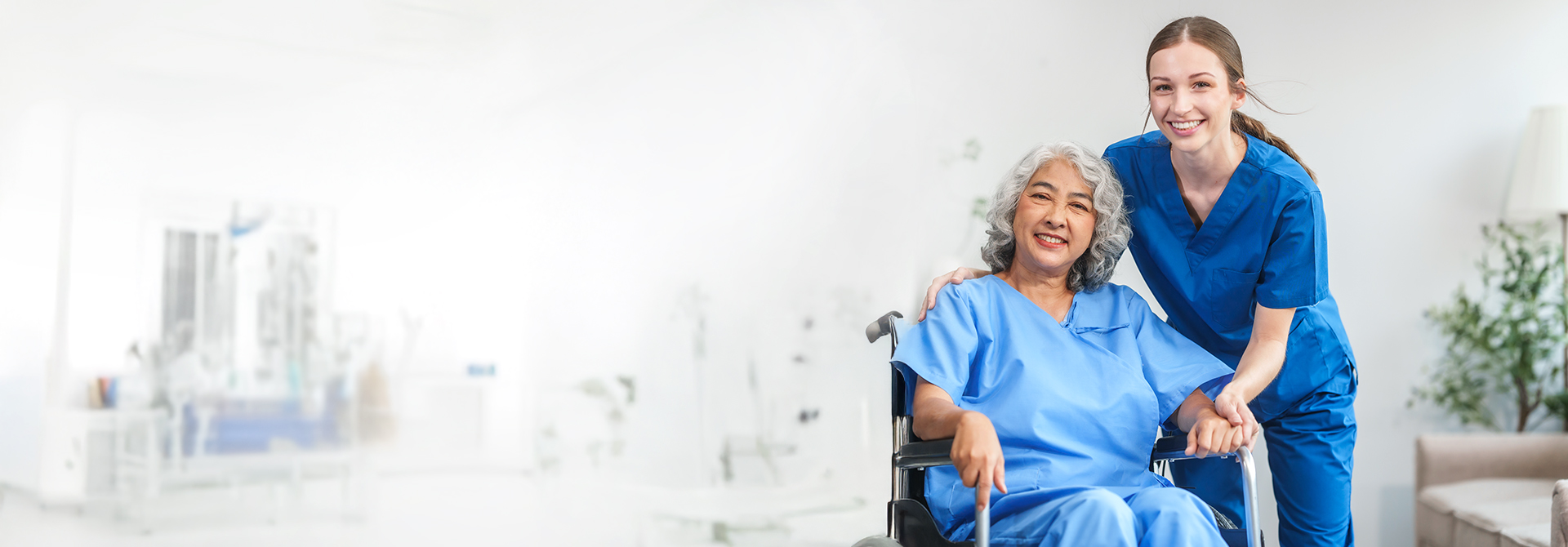 A caregiver assisting an elderly woman in walking with the aid of a walker